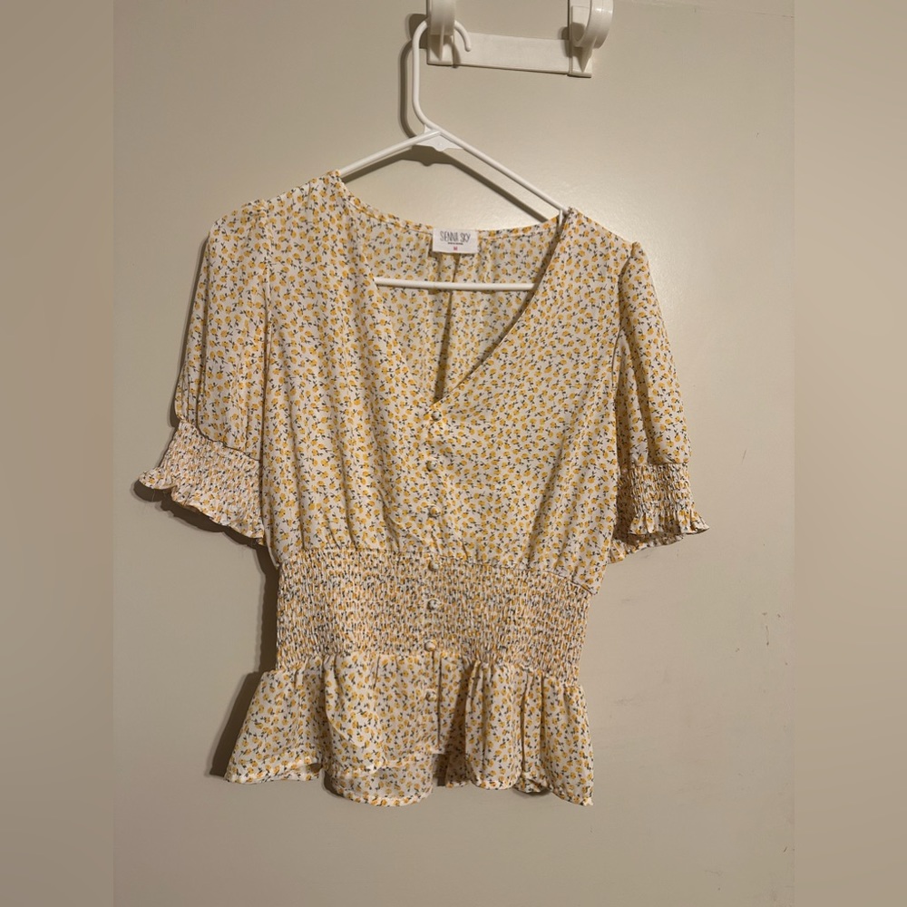 Sienna Sky short sleeved blouse.